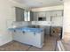 Modern kitchen with gray cabinetry, stainless steel microwave, and plenty of room to move around at 1448C Maplewood Dr, Durham, NC 27704