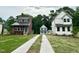 Charming street view showcasing three homes with modern designs, manicured lawns, and inviting driveways at 1448C Maplewood Dr, Durham, NC 27704