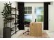 Contemporary home office boasts a rustic wooden desk, shelving unit, area rug and plenty of light at 1542 Crescent Townes Way, Raleigh, NC 27604