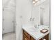 Bright bathroom features a vanity with a solid surface countertop and a framed mirror at 1709 Shamrock Ln, Rocky Mount, NC 27804