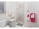 Traditional bathroom featuring a shower/tub combo, patterned wallpaper, and a decorative waste paper basket at 1709 Shamrock Ln, Rocky Mount, NC 27804