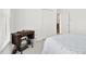 Cozy bedroom features neutral carpet, white walls, vintage sewing machine table at 1709 Shamrock Ln, Rocky Mount, NC 27804
