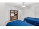 Bedroom featuring two twin beds, a bookshelf, and bright white walls at 1709 Shamrock Ln, Rocky Mount, NC 27804
