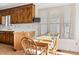 Cozy breakfast nook with wood table, chairs, and bright window at 1709 Shamrock Ln, Rocky Mount, NC 27804