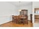 Elegant dining room with hardwood floors, wainscoting, and wooden dining set at 1709 Shamrock Ln, Rocky Mount, NC 27804