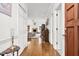 Bright foyer with hardwood floors leading to living room and featuring piano at 1709 Shamrock Ln, Rocky Mount, NC 27804