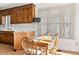 Eat-in kitchen with a wooden table set, floral wallpaper, and a bright window view at 1709 Shamrock Ln, Rocky Mount, NC 27804