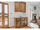 Cozy kitchen nook with wood cabinetry, a sink, and a view to the outdoor patio at 1709 Shamrock Ln, Rocky Mount, NC 27804