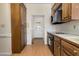 Well-organized kitchen area with wood cabinets and functional appliances at 1709 Shamrock Ln, Rocky Mount, NC 27804
