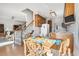 Eat-in kitchen with wood table, view into the living room, and convenient access to appliances at 1709 Shamrock Ln, Rocky Mount, NC 27804