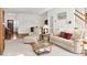 Bright living room with neutral carpeting, a glass coffee table, and comfortable seating at 1709 Shamrock Ln, Rocky Mount, NC 27804