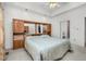 This main bedroom features a ceiling fan, wall-to-wall carpeting, and an integrated headboard and cabinets at 1709 Shamrock Ln, Rocky Mount, NC 27804