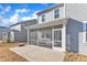 This backyard has a covered patio, providing an outdoor area for dining and relaxation at 1776 Golden Honey Dr, Wake Forest, NC 27587