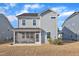 A house has a neatly maintained backyard featuring a patio area with a covered area at 1776 Golden Honey Dr, Wake Forest, NC 27587