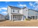 The property includes a well-maintained backyard with a patio and a view of neighboring houses at 1776 Golden Honey Dr, Wake Forest, NC 27587