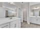 Bright bathroom with dual vanities, sleek countertops, and modern fixtures at 1776 Golden Honey Dr, Wake Forest, NC 27587
