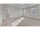 Bedroom with plenty of light from two windows and neutral colored walls at 1776 Golden Honey Dr, Wake Forest, NC 27587