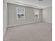 Large bedroom with neutral walls, modern lighting and multiple windows at 1776 Golden Honey Dr, Wake Forest, NC 27587
