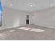 Bedroom with neutral walls, carpet, modern lighting and attached laundry room at 1776 Golden Honey Dr, Wake Forest, NC 27587