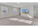 Bonus room featuring neutral walls, modern lighting, and a large TV at 1776 Golden Honey Dr, Wake Forest, NC 27587