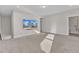Spacious bonus room with large television, neutral walls and plush carpet at 1776 Golden Honey Dr, Wake Forest, NC 27587