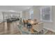 Open dining area with hardwood floors, stylish furniture, and plenty of natural light at 1776 Golden Honey Dr, Wake Forest, NC 27587