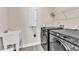 Functional laundry room with modern appliances and a utility sink at 1776 Golden Honey Dr, Wake Forest, NC 27587