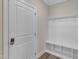 Mudroom area with coat hooks, bench and cubbies at 1776 Golden Honey Dr, Wake Forest, NC 27587