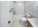 Well-lit bathroom with a shower-tub combo, toilet, vanity, and modern fixtures at 1908 Mystic Dr, Durham, NC 27712