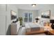 Cozy bedroom with large window, comfortable queen bed, and modern decor at 1908 Mystic Dr, Durham, NC 27712