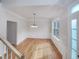 Elegant dining room with hardwood floors, wainscoting, a chandelier, and natural light at 1908 Mystic Dr, Durham, NC 27712