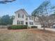 Charming two-story home featuring landscaped front yard, attached garage, and neutral color palette at 1908 Mystic Dr, Durham, NC 27712