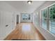 Spacious living area with hardwood floors, natural light, and a door to the deck at 1908 Mystic Dr, Durham, NC 27712