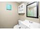 Cozy bathroom with a vanity, medicine cabinet and blue wall art at 2011 Quaker Lndg # 101, Raleigh, NC 27603