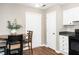 The kitchen area includes a dining table and multiple entryways at 2011 Quaker Lndg # 101, Raleigh, NC 27603