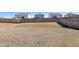 Expansive backyard featuring a wood fence and gentle slope, offering privacy and potential for outdoor activities at 2105 Attend Xing, Fuquay Varina, NC 27526
