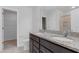 This bathroom features a double sink vanity with granite countertops and a tiled floor at 2105 Attend Xing, Fuquay Varina, NC 27526