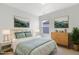 Bedroom featuring bright decor, large window, and comfortable bed with stylish bedding at 2105 Attend Xing, Fuquay Varina, NC 27526