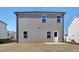 Back of house featuring simple siding, door and windows at 2105 Attend Xing, Fuquay Varina, NC 27526