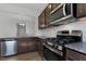 Modern kitchen with stainless steel appliances and granite countertops at 2105 Attend Xing, Fuquay Varina, NC 27526