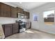 Modern kitchen with stainless steel appliances, white subway tile, and light wood floors at 2105 Attend Xing, Fuquay Varina, NC 27526