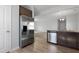 Kitchen featuring stainless steel appliances, granite countertops, and wood floors at 2105 Attend Xing, Fuquay Varina, NC 27526