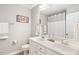 Bright bathroom with double vanity, ample lighting, and updated fixtures at 244 W Copenhaver Dr, Clayton, NC 27527
