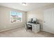Bright bedroom with a large window, carpet flooring, and a well-lit workspace with a classic desk at 244 W Copenhaver Dr, Clayton, NC 27527
