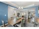 Bright dining room with modern furniture, lighting, and open floor plan at 244 W Copenhaver Dr, Clayton, NC 27527