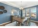 Bright dining room with modern furniture, lighting, and decor at 244 W Copenhaver Dr, Clayton, NC 27527