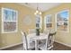 Cozy dining room with a round table, surrounded by bright, natural light at 244 W Copenhaver Dr, Clayton, NC 27527