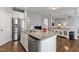 Spacious kitchen island with granite countertops and stainless steel appliances at 244 W Copenhaver Dr, Clayton, NC 27527