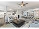 Cozy living room with neutral decor, ceiling fan, and open layout at 244 W Copenhaver Dr, Clayton, NC 27527