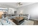Bright living room showcasing neutral tones, a ceiling fan, and an open layout at 244 W Copenhaver Dr, Clayton, NC 27527